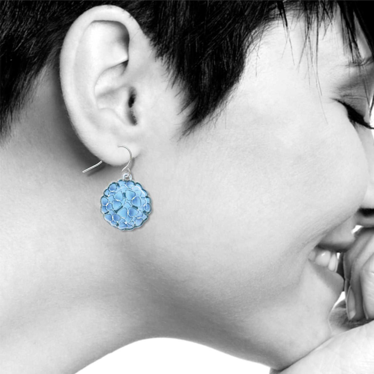 Close-up of a person wearing blue Hydrangeas earrings