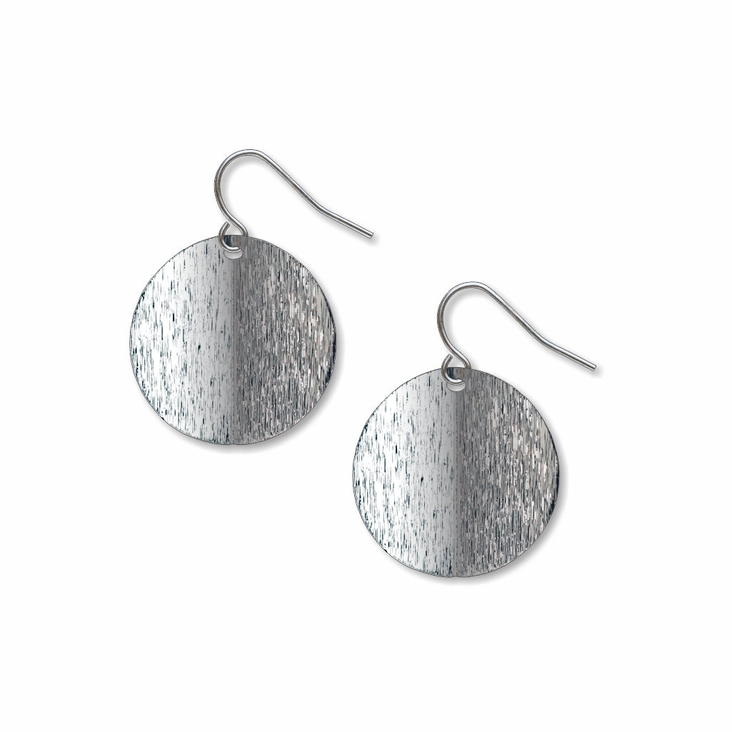 An Orb circular drop earring with a split-tone brushed silver finish and minimalist modern design inspired by Ellsworth Kelly’s sculptural artwork