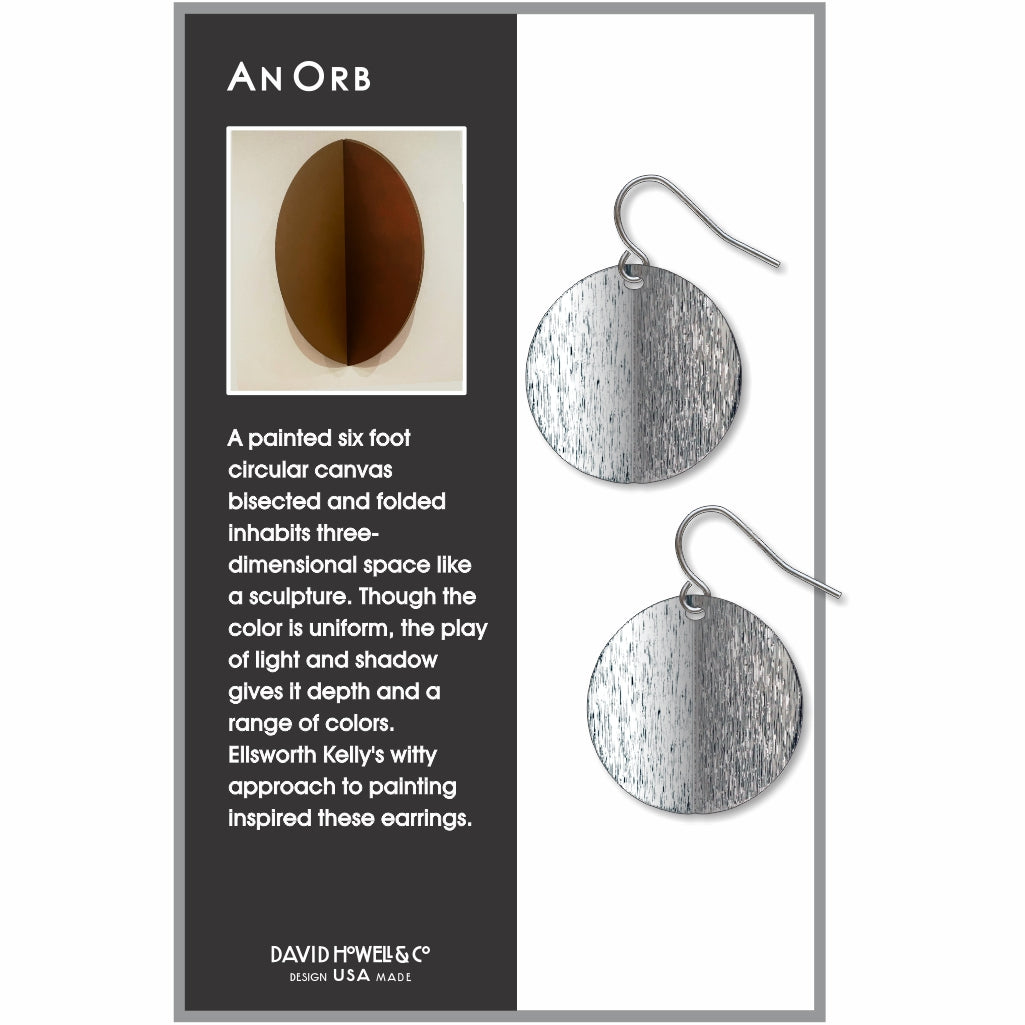 An Orb circular drop earrings inspired by Ellsworth Kelly, featuring a split-tone brushed silver finish with a modern minimalist sculptural design