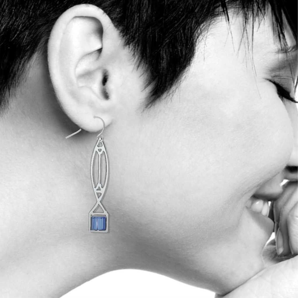 Winslow Lightscreen Earrings, silver-tone elongated geometric earring with translucent light blue stained-glass-inspired accents shown on model