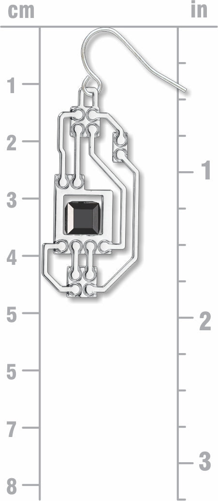 Circuits silver drop earring with openwork circuit board-inspired detailing and a faceted black geometric accent shown against a centimeter and inch measurement guide
