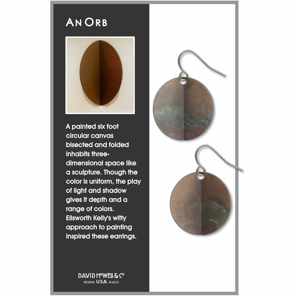 An Orb circular drop earrings inspired by Ellsworth Kelly with a softly mottled patina finish and sculptural modern design