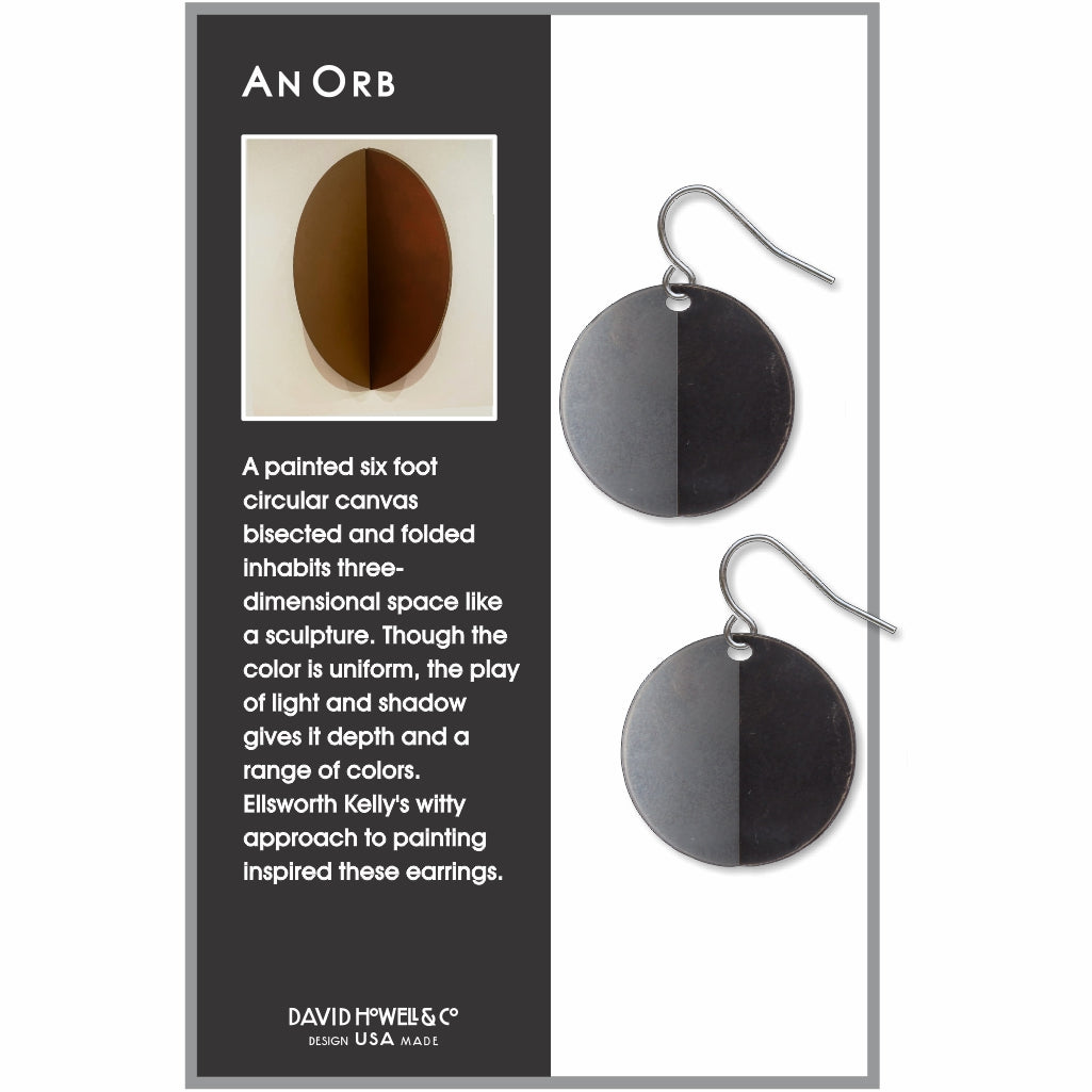 An Orb circular drop earrings inspired by Ellsworth Kelly, featuring a bold split-tone black and gray sculptural design with a modern minimalist look