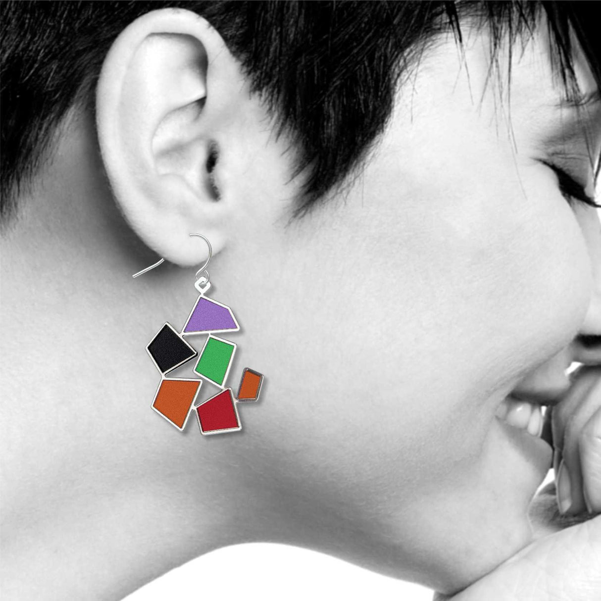 After Matisse Snail earrings shown worn, highlighting the colorful abstract geometric design inspired by Henri Matisse’s iconic collage artwork.