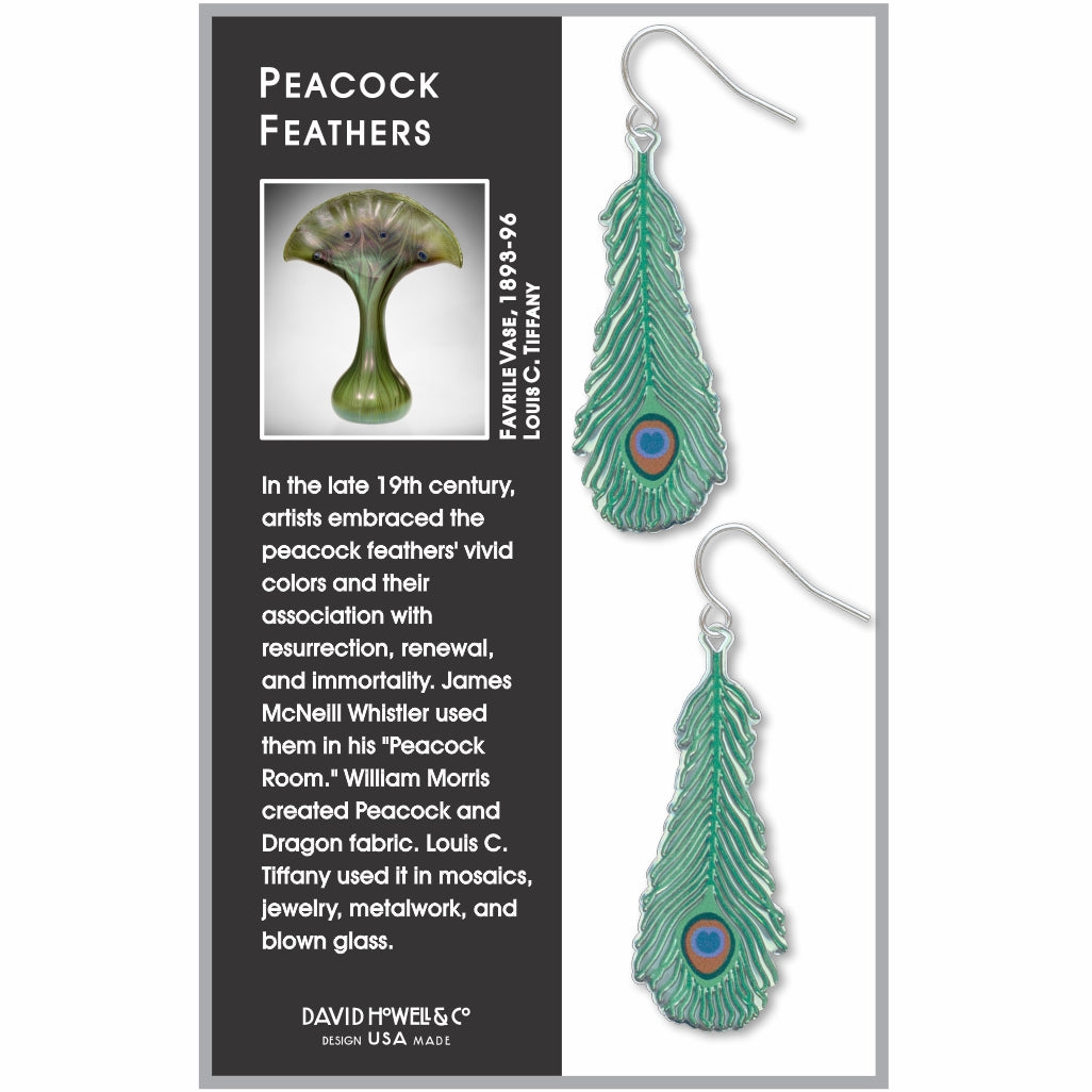 teal peacock feather shaped earrings in box with info card