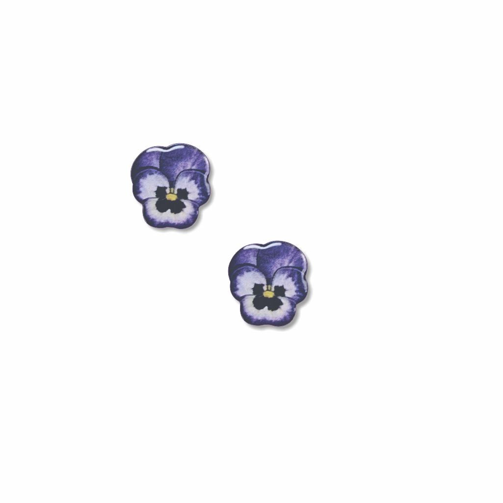 Two purple pansy flower earrings on a white background