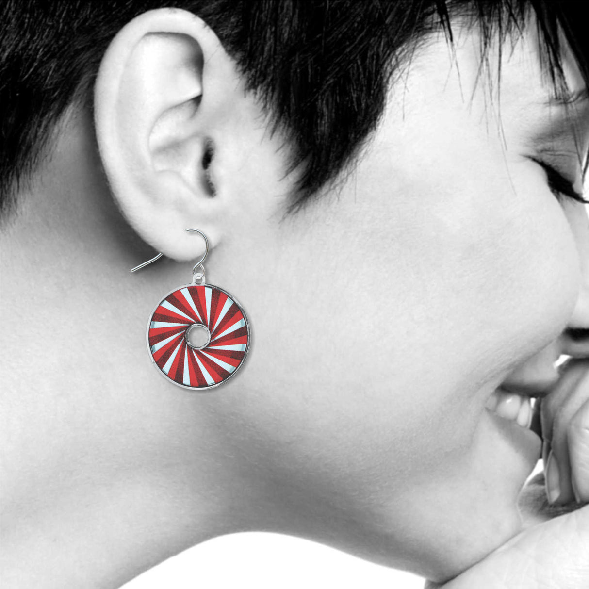 Rangoon Red earrings: red, and light blue spiral circle drop earring on model