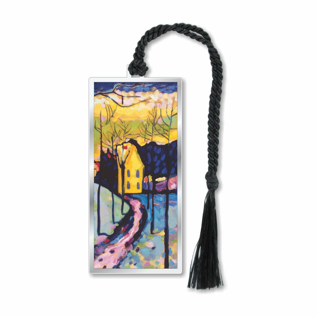 A silver metal bookmark featuring an abstract painting with geometric forms in blue, yellow, and pink, with a house and trees, completed with a black tassel.