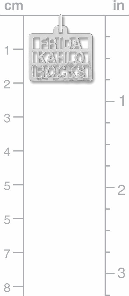 silver pendant with 'Frida Kahlo Rocks' text on a measurement chart.
