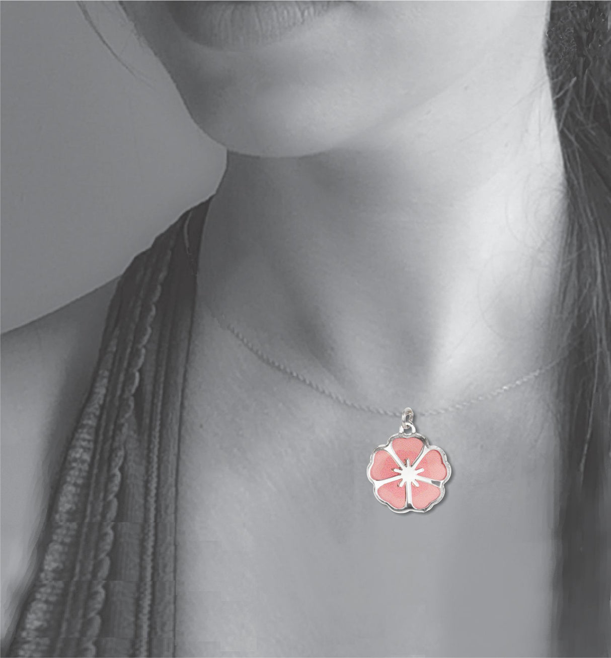 Model wearing the Single Blossom necklace, featuring a delicate silver-tone pendant with a soft pink sakura-inspired cherry blossom design.