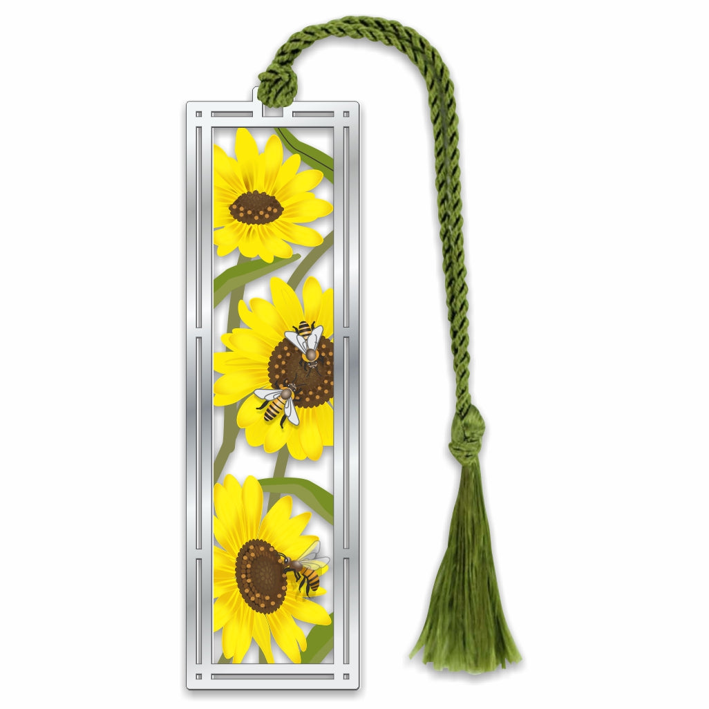 Metal bookmark featuring vibrant sunflower artwork inspired by Helianthus annuus with a green braided tassel, celebrating pollinator-friendly blooms known to support bee health and immunity.