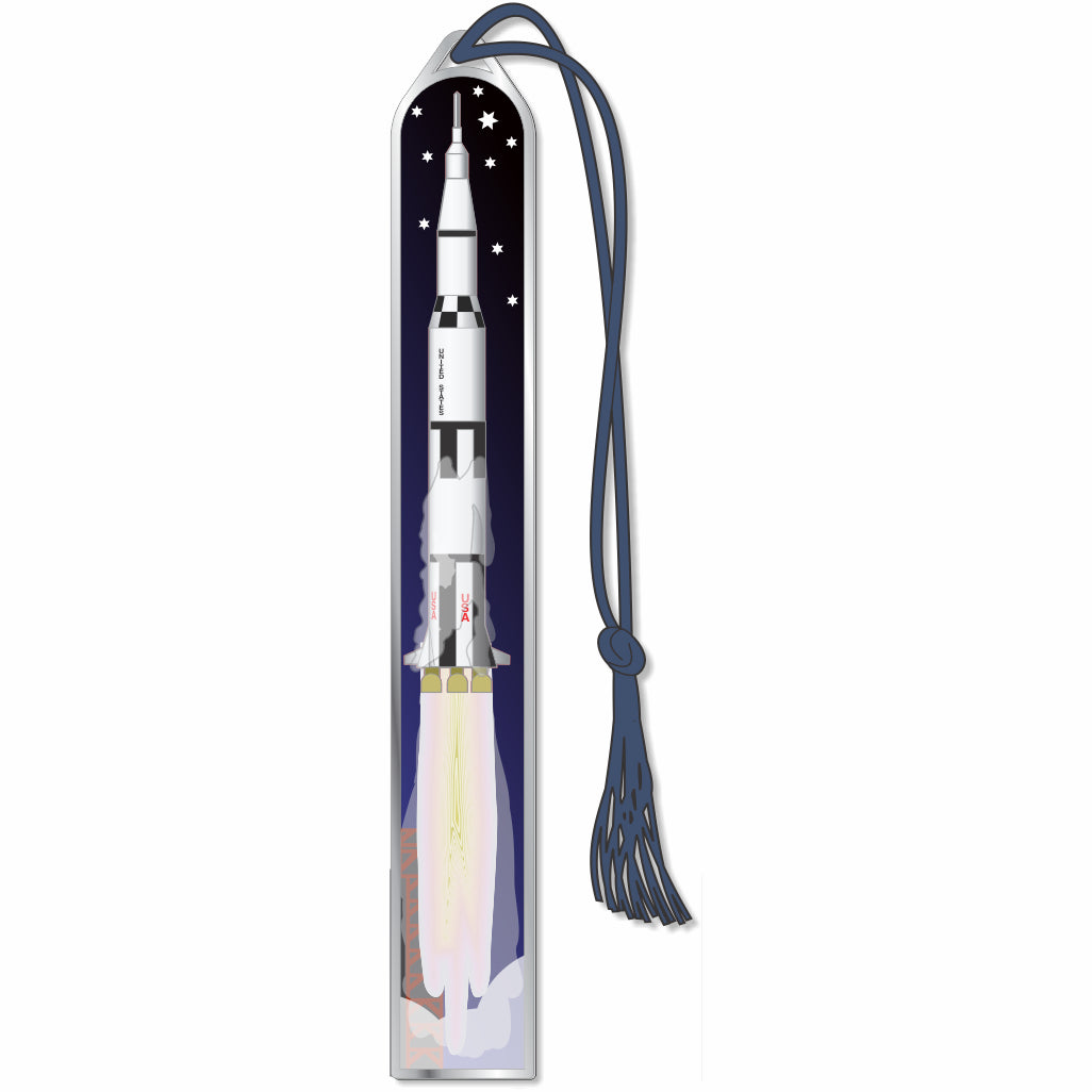 Apollo 11 Metal Bookmark depicting an astronaut on the Moon's surface, with a spacecraft and a dark sky, featuring a black braided tassel.