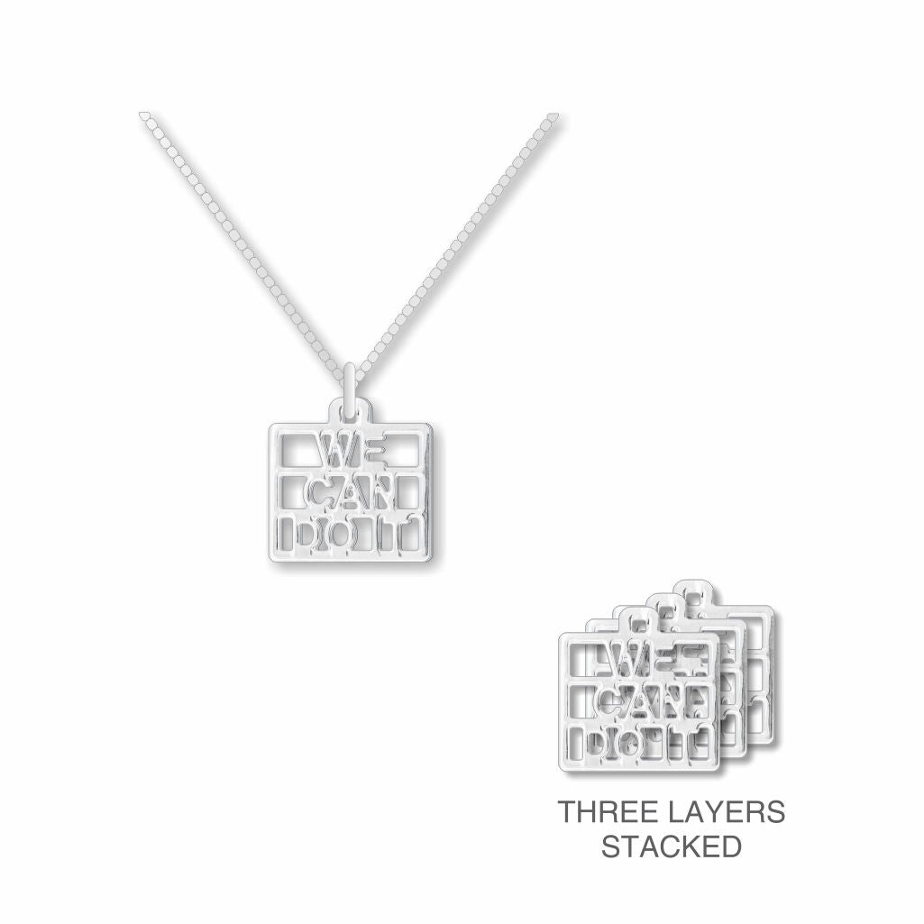 We Can Do It necklace with a silver cutout text pendant on a chain, shown alongside a side view highlighting the pendant’s three-layer stacked construction.