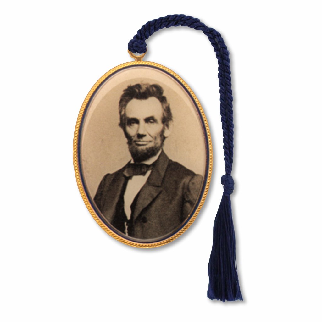 A metal bookmark featuring a portrait of Abraham Lincoln, with a tassel and gold-plated edges, with braided black tassel.