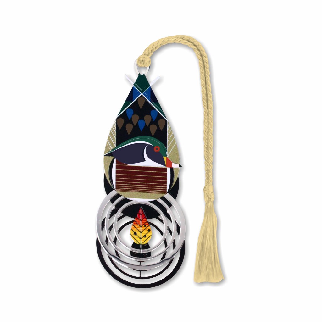 A metal bookmark in the shape of a duck with a sport coat and an autumn leaf with cream tassel.
