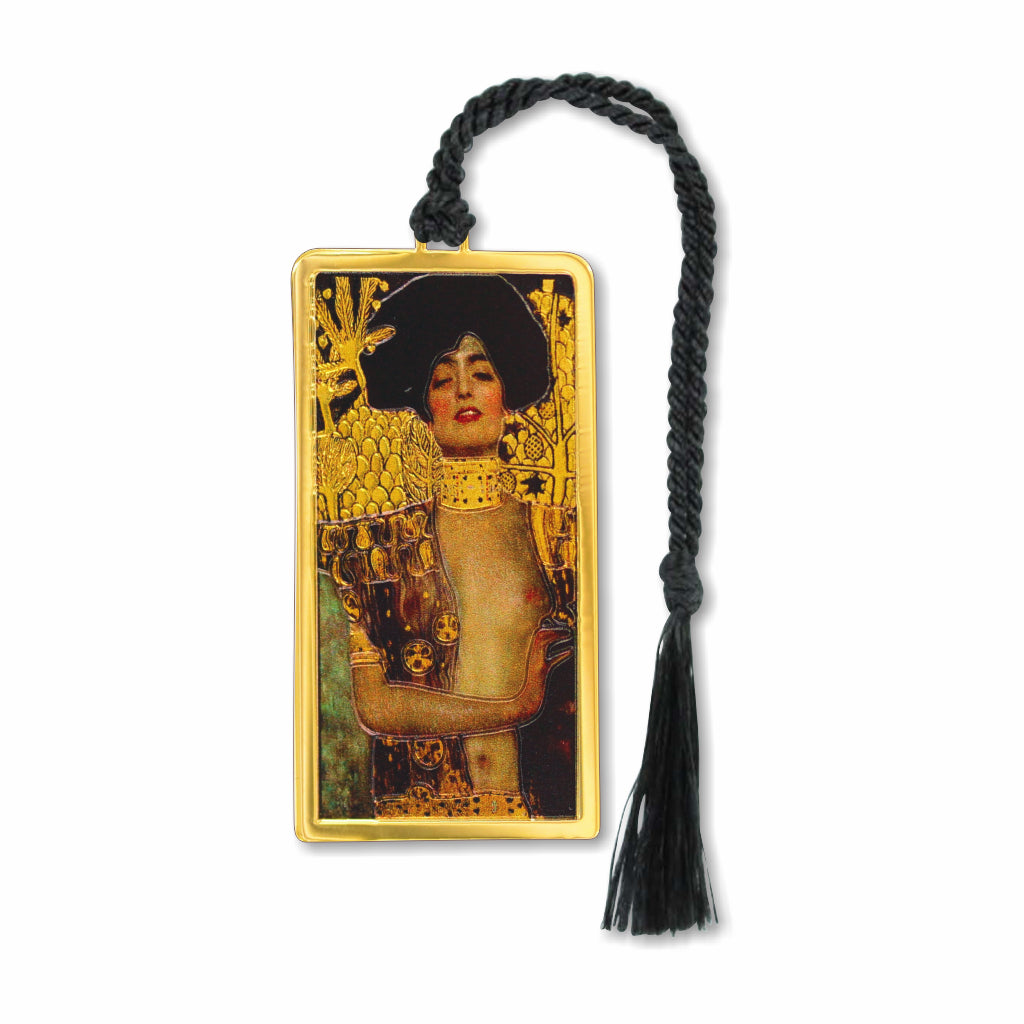 Gustav Klimt Judith metal bookmark featuring imagery inspired by Judith and the Head of Holofernes. The design reflects Klimt’s distinctive Vienna Secession style, with ornamental detail and a focus on the female figure, evoking themes of beauty, power, and sensual symbolism with black tassel.