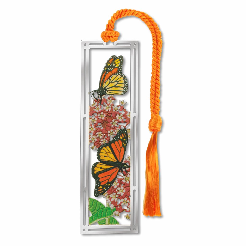 Metal bookmark featuring monarch butterflies with orange-and-black wings and milkweed plants, symbolizing pollinator conservation and habitat restoration for declining monarch populations with orange braided tassel.
