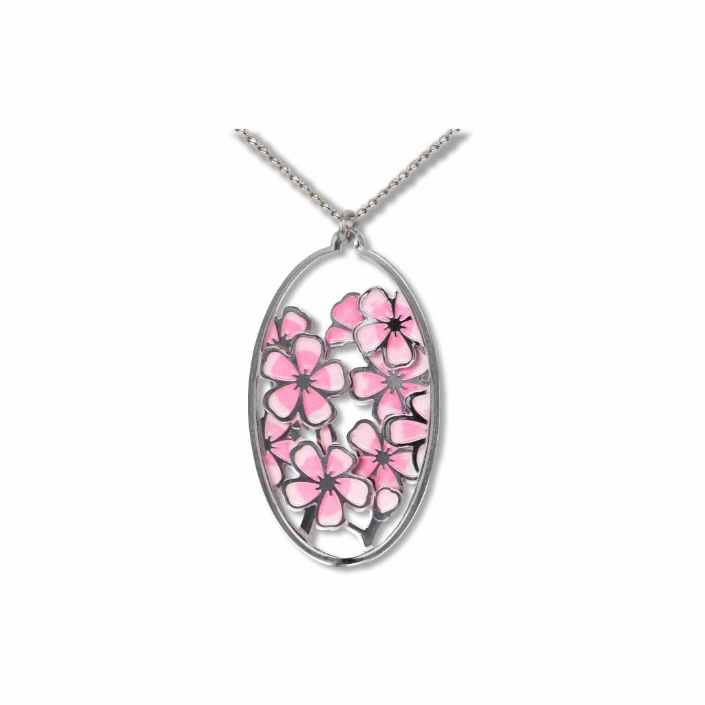Hiroshige Cherry Blossom pendant necklace featuring an oval silver-tone pendant filled with pink cherry blossom flowers and delicate openwork branch detailing on a silver chain.