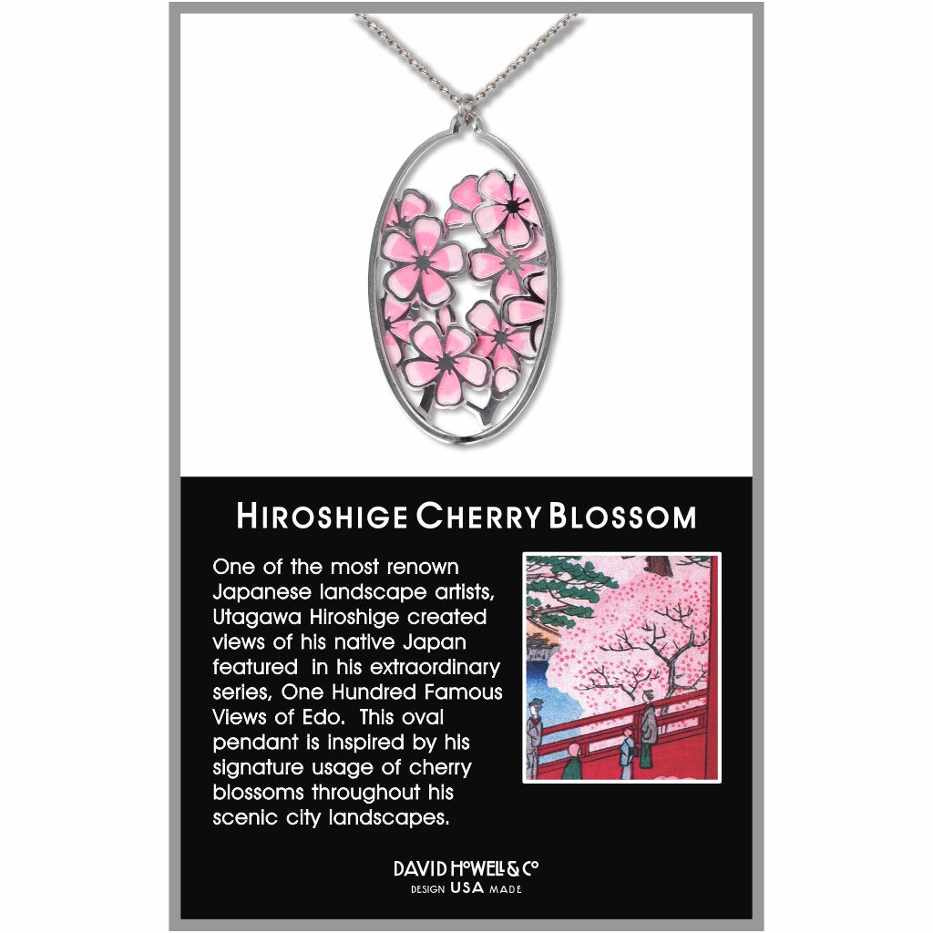Hiroshige Cherry Blossom pendant necklace featuring an oval silver-tone charm with layered pink cherry blossom flowers inspired by Japanese landscape art.