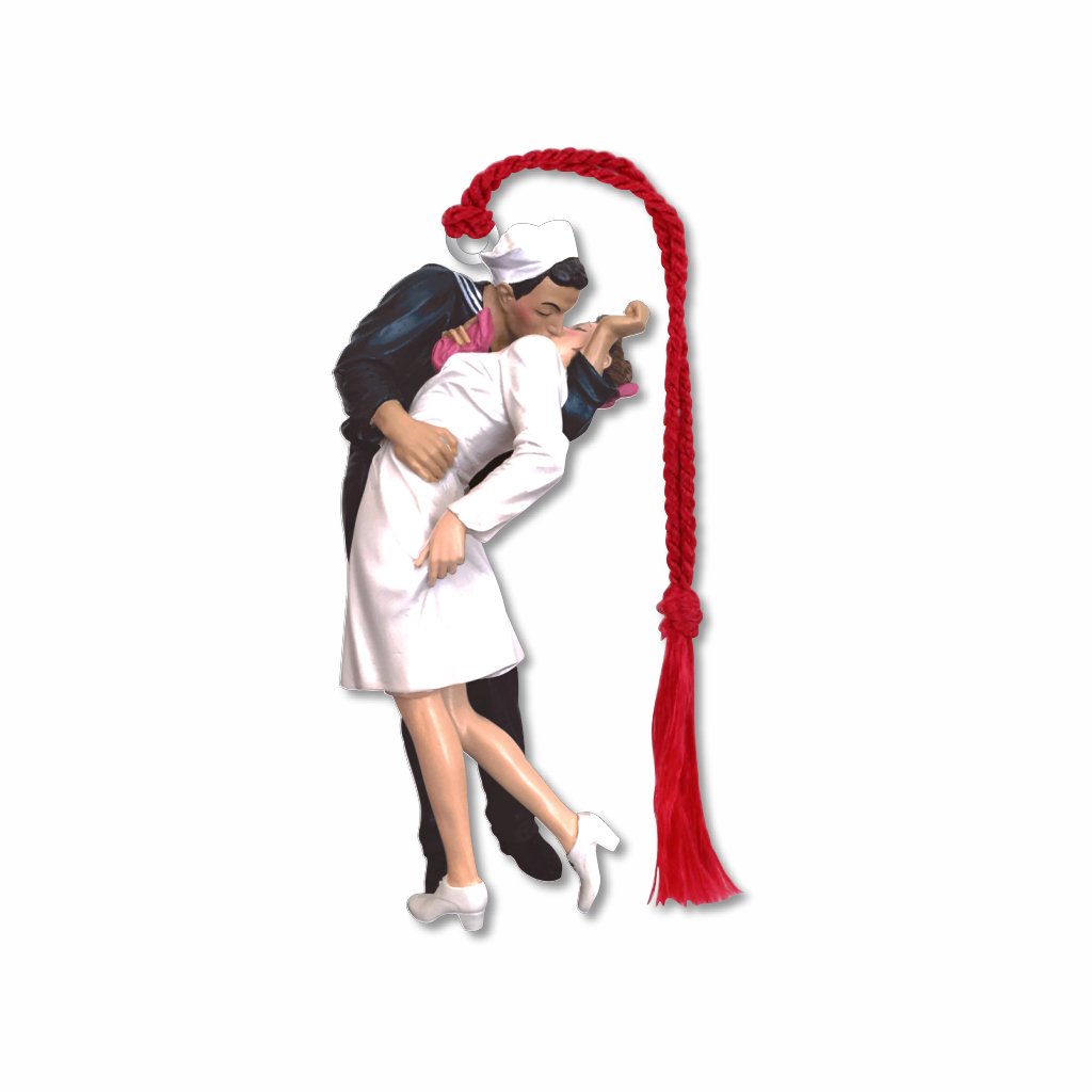 A metal bookmark featuring an image of a sailor kissing a nurse in Times Square, inspired by the V-J Day Kiss photograph with braided red tassel.