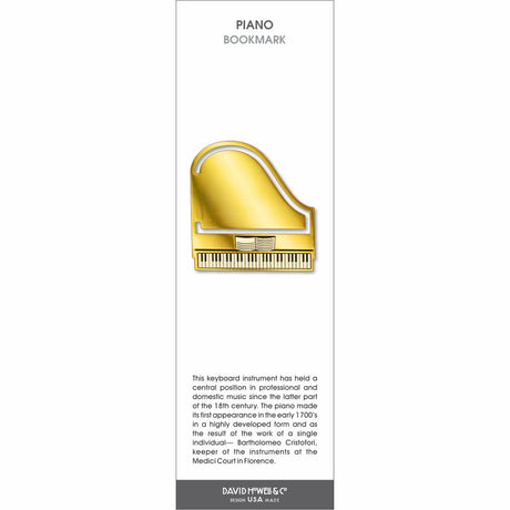 Gold piano bookmark shaped like a grand piano with visible keys and a polished metallic finish.