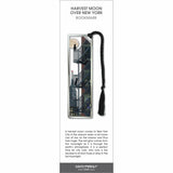 Harvest Moon Over New York bookmark with city fire escape, full moon, skyline, and black tassel.