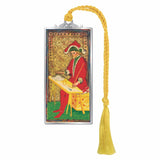 A rectangular metal bookmark featuring a vintage-style illustration of a robed figure at a table, with a decorative silver top loop and a long yellow tassel.