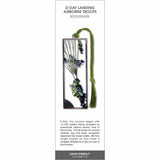 D-Day Airborne Troops’ bookmark showing a paratrooper descending by parachute with aircraft overhead and green tassel.