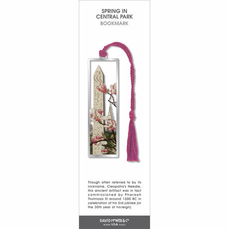 Spring in Central Park’ bookmark featuring cherry blossoms and city monument scene, with a pink braided tassel.