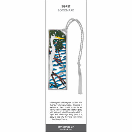 Egret’ bookmark featuring a white egret with a yellow beak standing among branches over water, with a light gray tassel.
