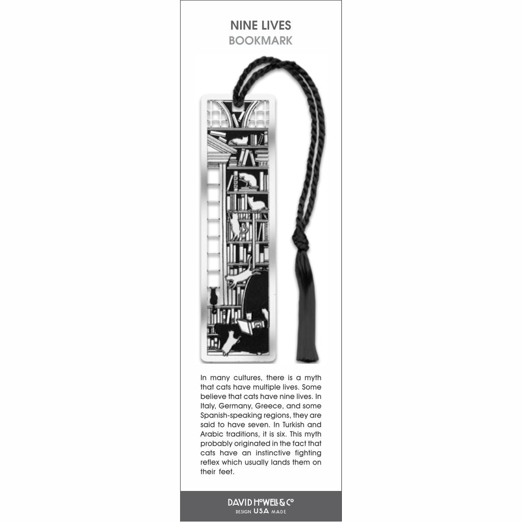 Nine Lives’ bookmark featuring black-and-white cats climbing and lounging on bookshelves, with a black tassel.