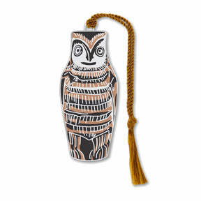 A silver metal bookmark in the shape of an owl with geometric patterns, featuring a silver finish with black and brown details, and a brown tassel.