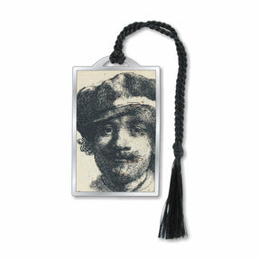 A silver metal bookmark featuring a black and white print of Rembrandt's self-portrait, with a silver finish and a black tassel.