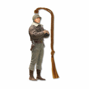A metal bookmark of General George Smith Patton, Jr. in a military uniform, holding binoculars with brown tassel.