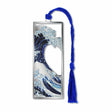 Metal bookmark featuring Katsushika Hokusai’s The Great Wave off Kanagawa, showing a towering curling wave threatening small boats with Mount Fuji in the distance, rendered in classic Edo-period ukiyo-e style with bold blue tones and dramatic composition with blue braided tassel.