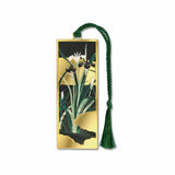 A metal bookmark with a gold finish featuring a floral design with gold accents, green leaves and floral buds attached to a green braided tassel.