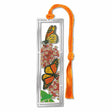 Metal bookmark featuring monarch butterflies with orange-and-black wings and milkweed plants, symbolizing pollinator conservation and habitat restoration for declining monarch populations with orange braided tassel.