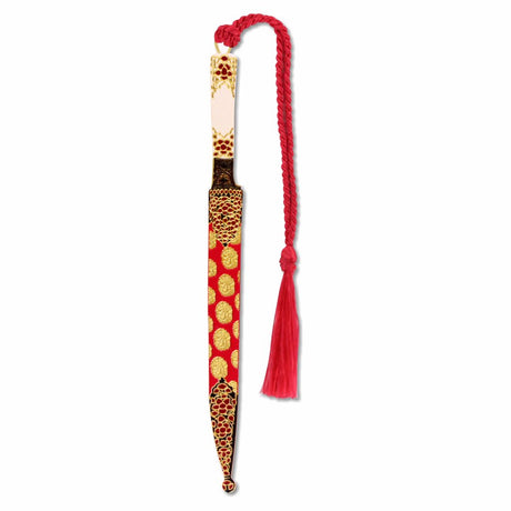 A decorative metal bookmark designed to resemble a Mughal dagger with a gold finish, floral patterns, and a red tassel.